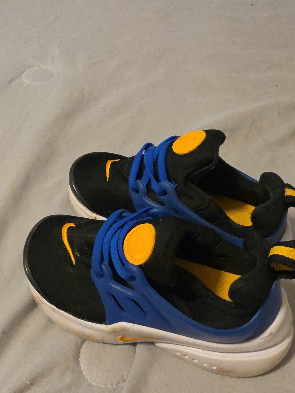 Nike Kids Black and Blue Sneakers with Yellow Accents